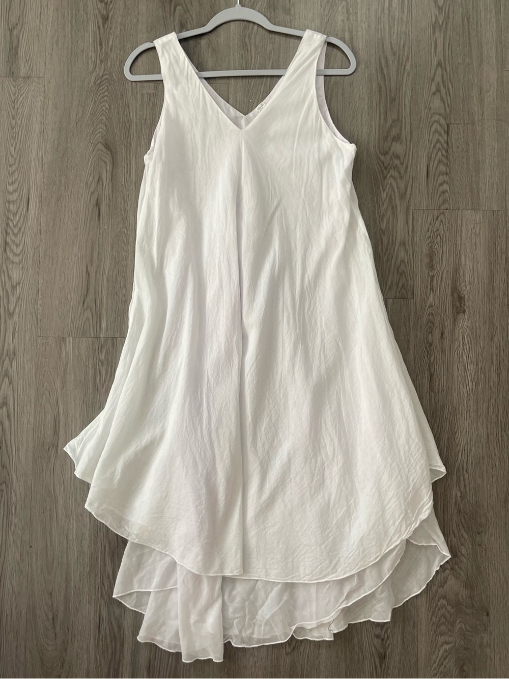 Flowy white sleeveless dress with v neckline and asymmetrical layered hem large